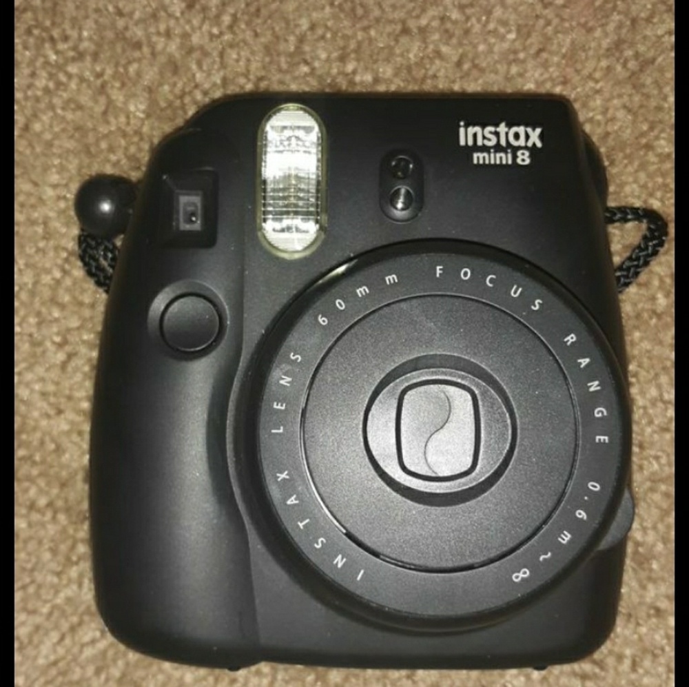 Instant Polaroid camera with purple case